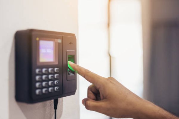Finger print scan, Male employees press sensors to record company attendance time and after work, Time Recorder Attendance - Out work, Encryption for identity verification or electronic signing