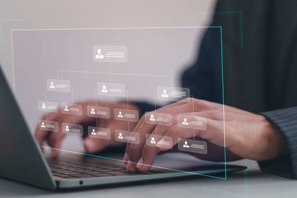 Businessman using laptop with workflow automation system with data diagram of the hierarchical structure of departments in business organization. Business workflow process management.