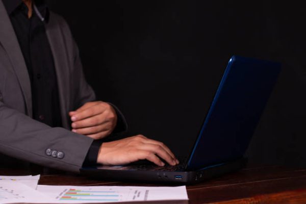 Businessman exercising his executive functions in a modern office in an elegant suit.