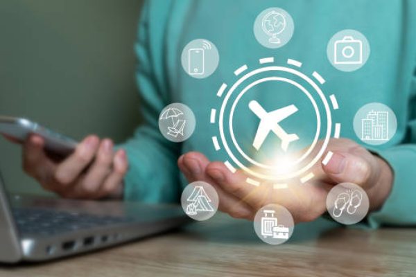 Concept of planning a flight, booking a ticket to travel around the world, using mobile phone or laptop.