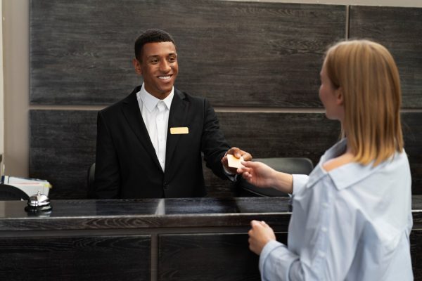 receptionist-elegant-suit-work-hours-with-customer_23-2149714444